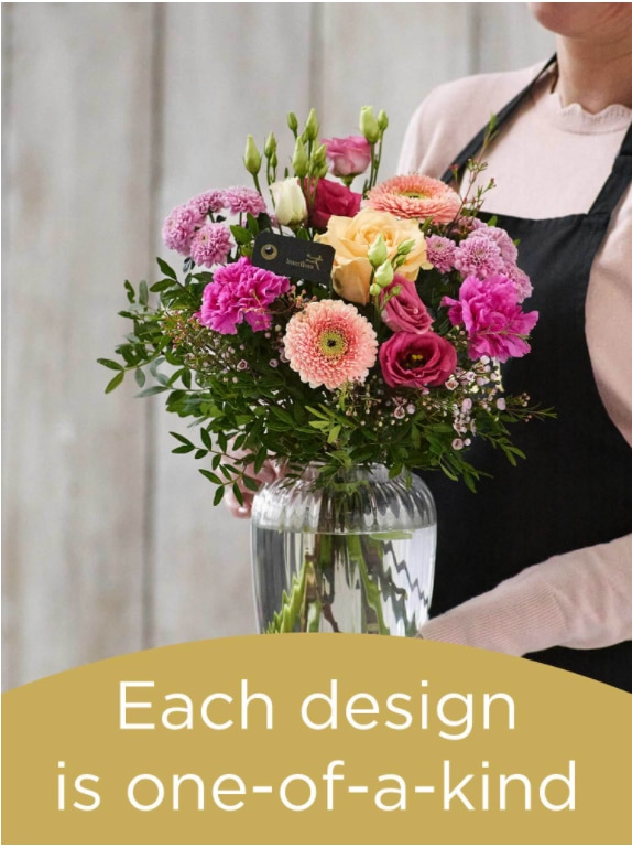 Bouquet and vase made with seasonal flowers Flower Arrangement
